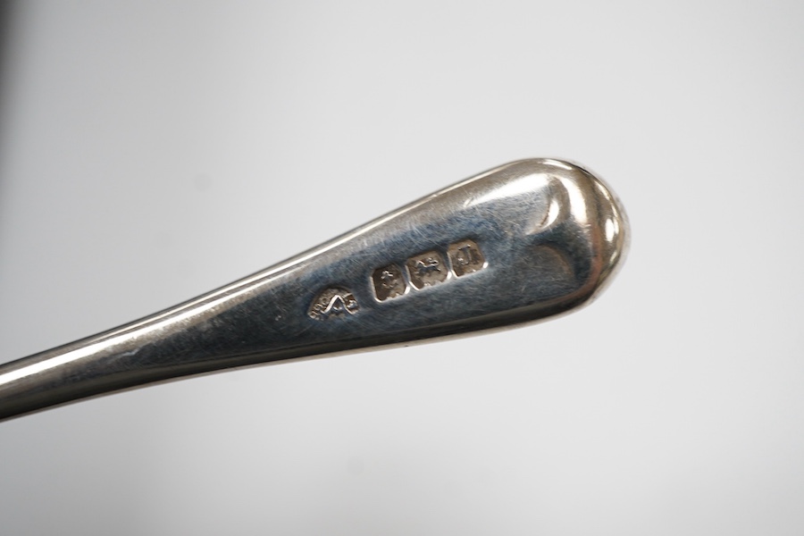 A cased six piece silver condiment set by Finnegans, Ltd, Birmingham, 1940, together with four earlier matched silver condiment spoons by Adie Brothers, 20oz.